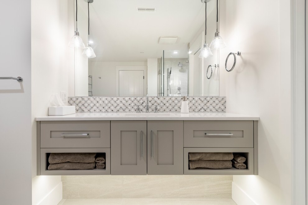 This is an example of a large transitional kids bathroom in Vancouver with shaker cabinets, beige cabinets, engineered quartz benchtops, white benchtops, a single vanity and a floating vanity.