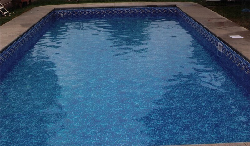 Pool - mid-sized backyard concrete paver and rectangular lap pool idea