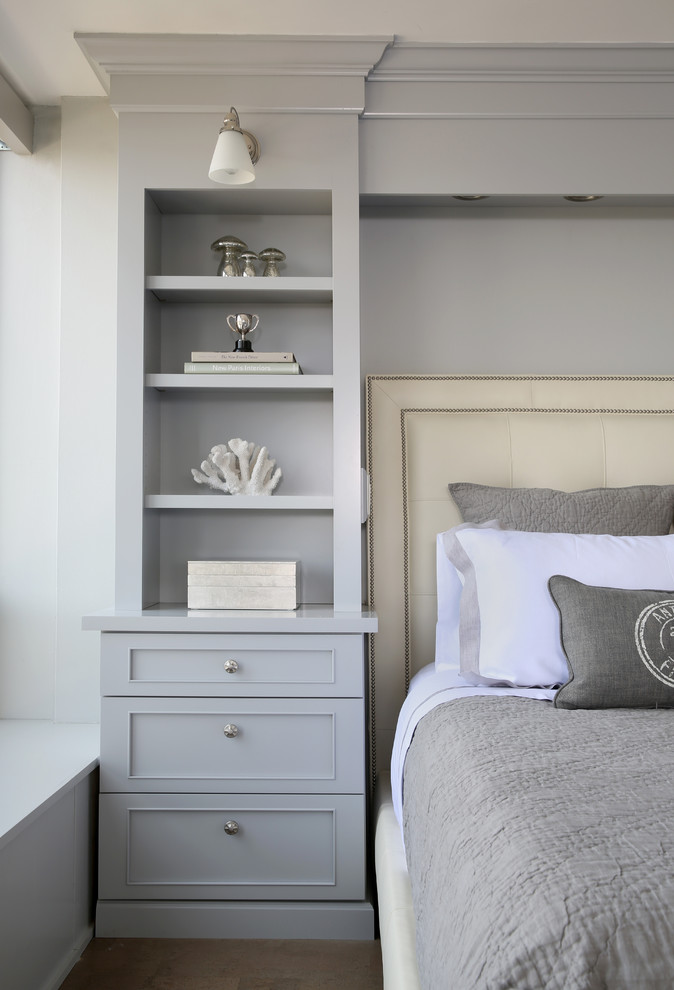 This is an example of a small transitional master bedroom in Chicago with grey walls and no fireplace.