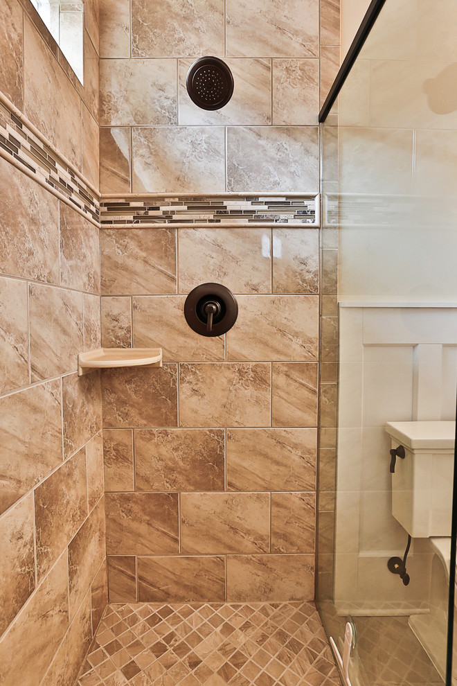 Mid-sized traditional 3/4 bathroom in Atlanta with an integrated sink, furniture-like cabinets, dark wood cabinets, an alcove shower, a two-piece toilet, beige tile, ceramic tile, beige walls and ceramic floors.