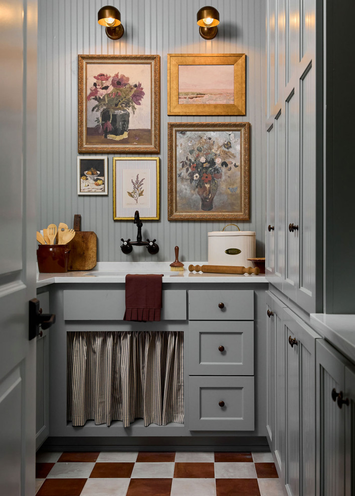 Laundry room - farmhouse u-shaped multicolored floor and wall paneling laundry room idea in Oklahoma City with an undermount sink, shaker cabinets, gray cabinets, gray walls and white countertops