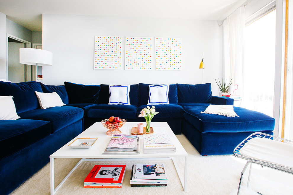 This is an example of a transitional living room in San Francisco with white walls.