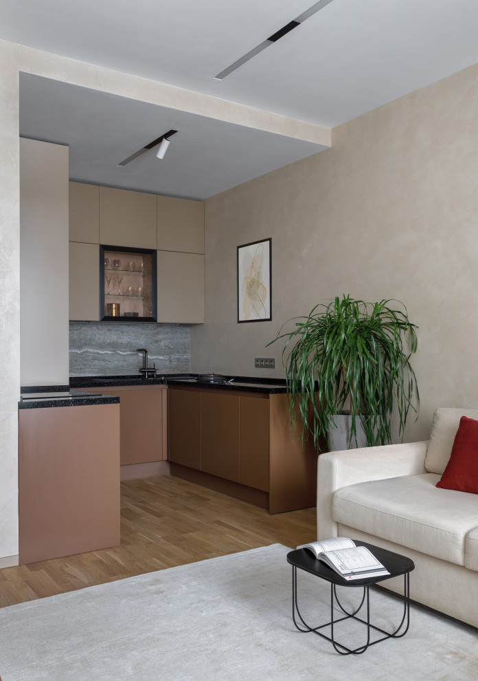 This is an example of a small contemporary u-shaped kitchen in Moscow.