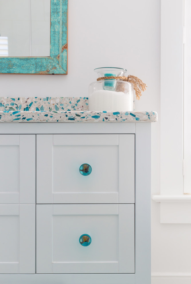 Design ideas for a small beach style 3/4 bathroom in Charleston with furniture-like cabinets, white cabinets, white walls, cement tiles, recycled glass benchtops, beige floor and multi-coloured benchtops.