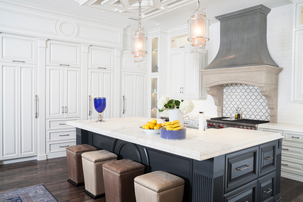 Design ideas for a large mediterranean open plan kitchen in Tampa with raised-panel cabinets, white cabinets, multi-coloured splashback, stainless steel appliances, dark hardwood floors, with island, an undermount sink, marble benchtops and subway tile splashback.