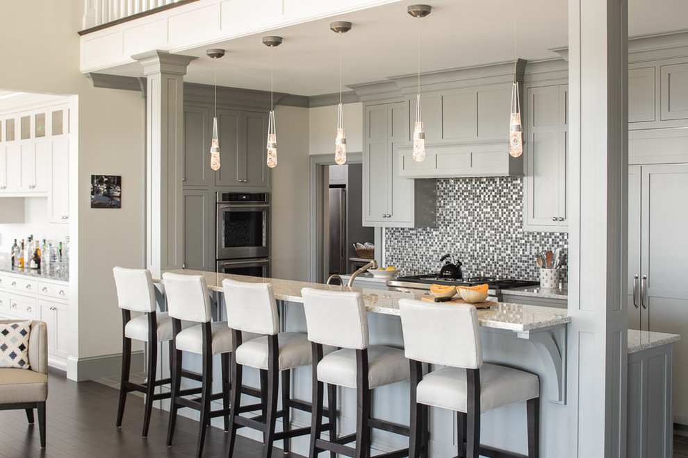 Design ideas for a transitional single-wall open plan kitchen in Portland Maine with shaker cabinets, grey cabinets, multi-coloured splashback, mosaic tile splashback, stainless steel appliances, dark hardwood floors, with island and granite benchtops.