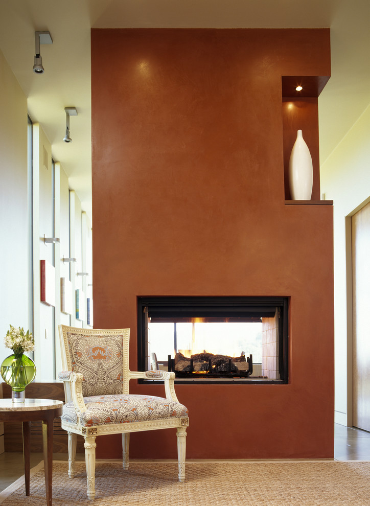 Contemporary living room in San Francisco with a two-sided fireplace.