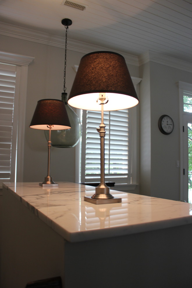 Inspiration for a large transitional galley dark wood floor eat-in kitchen remodel in Baltimore with a farmhouse sink, shaker cabinets, white cabinets, wood countertops, white backsplash, ceramic backsplash, stainless steel appliances and an island