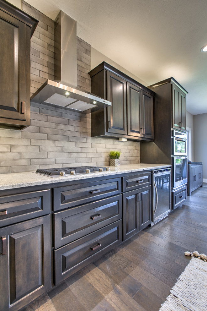 Eat-in kitchen - transitional l-shaped eat-in kitchen idea in Omaha with an island