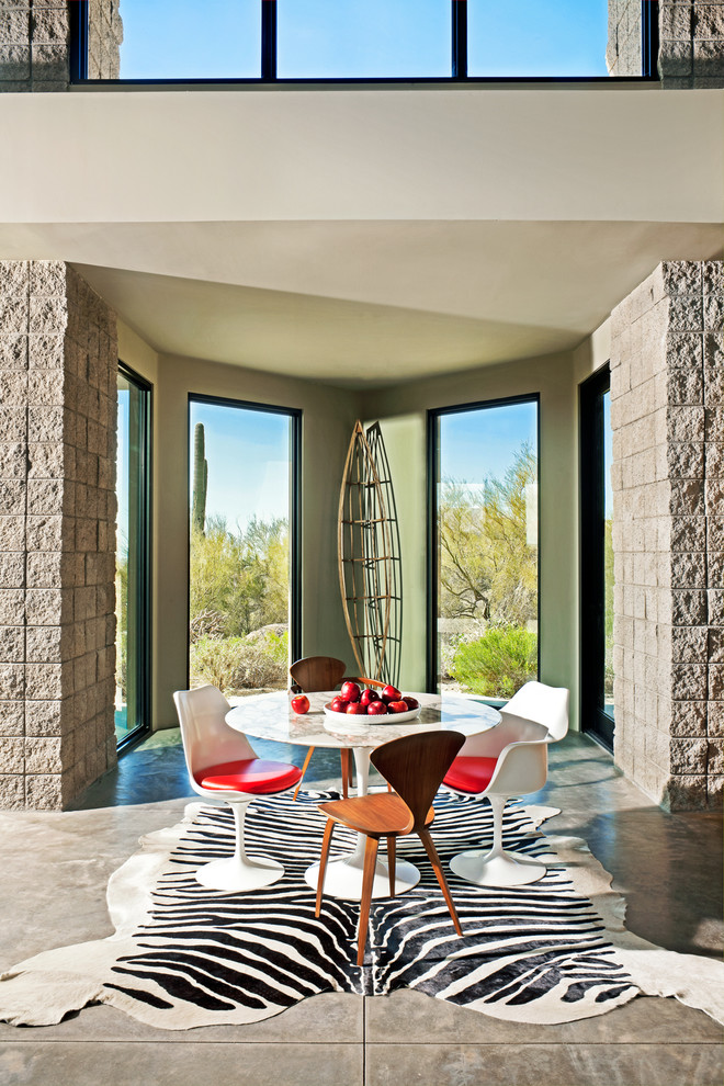 Inspiration for a contemporary dining room in Los Angeles with concrete floors.