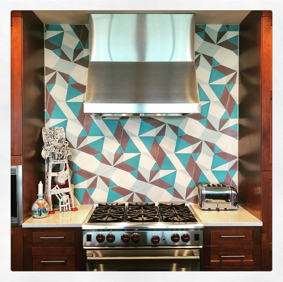 Inspiration for a transitional kitchen remodel in Austin with multicolored backsplash and white countertops