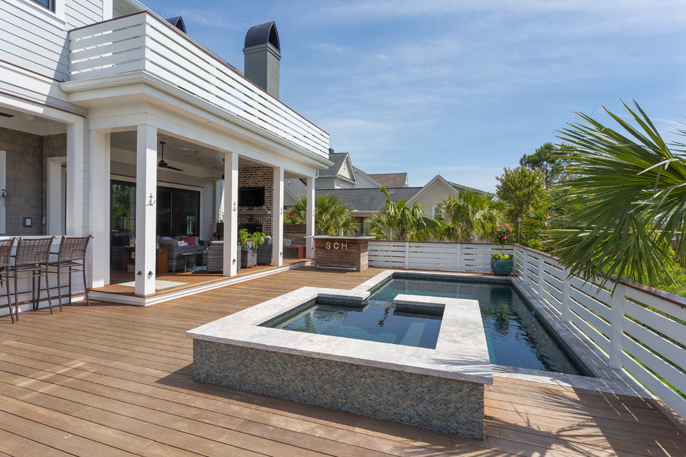 This is an example of a beach style backyard l-shaped pool in Charleston.