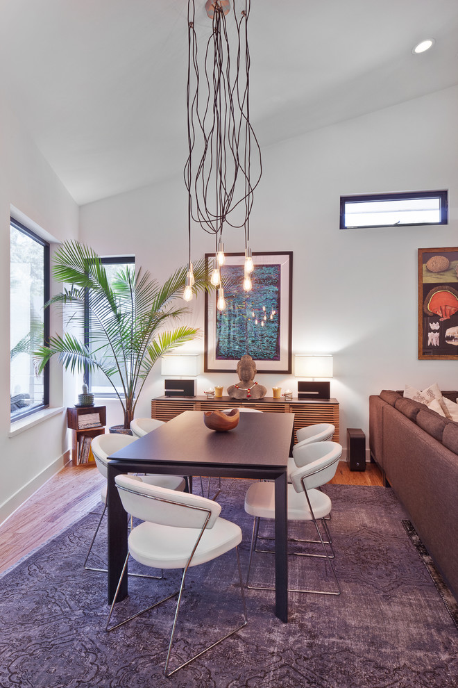 Photo of a modern dining room in Austin.