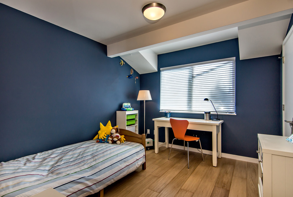 Boy Bedroom - Kids' bedroom - bedroom and mid-sized transitional boy medium tone wood floor kids' bedroom idea in San Francisco with blue walls