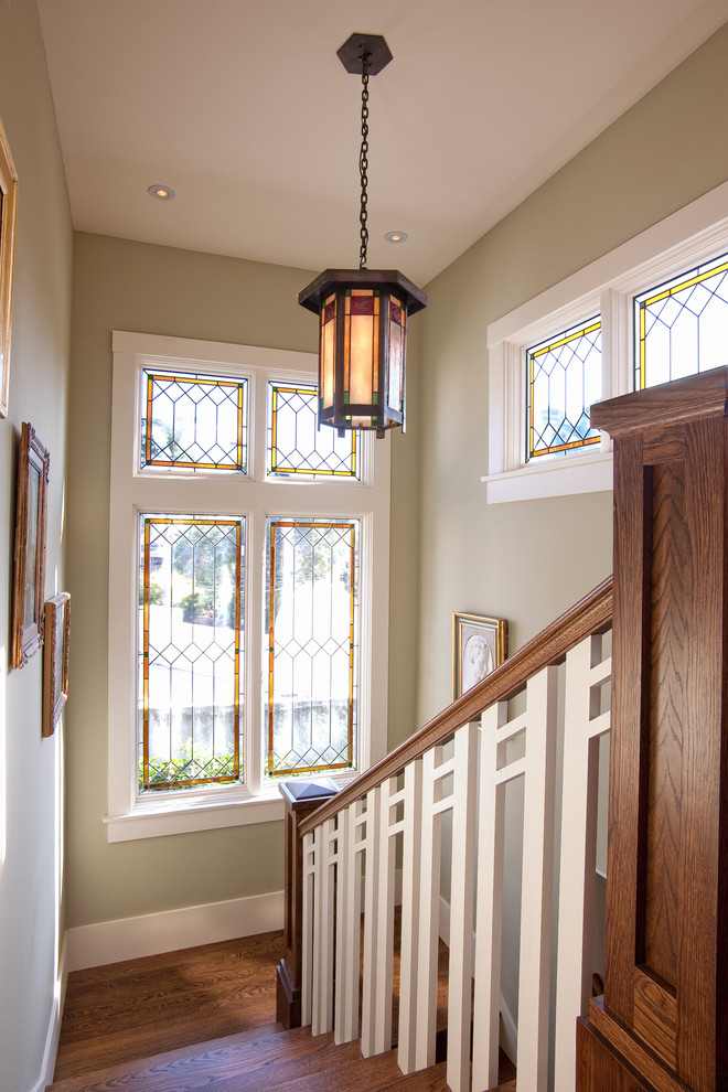 Design ideas for a mid-sized arts and crafts wood u-shaped staircase in San Diego with wood risers and wood railing.