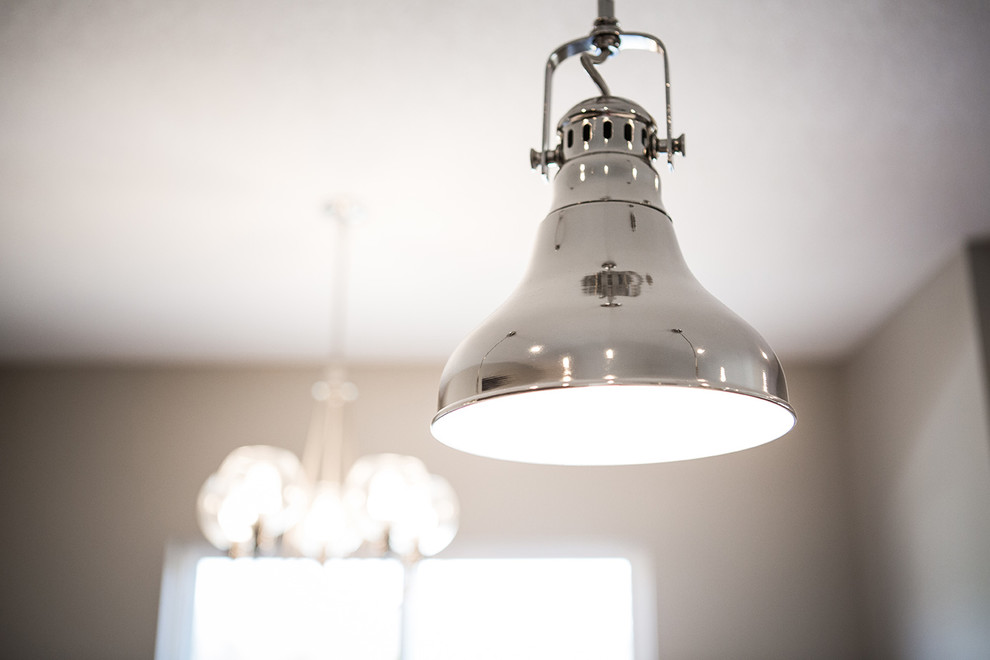 Example of a transitional home design design in Cedar Rapids