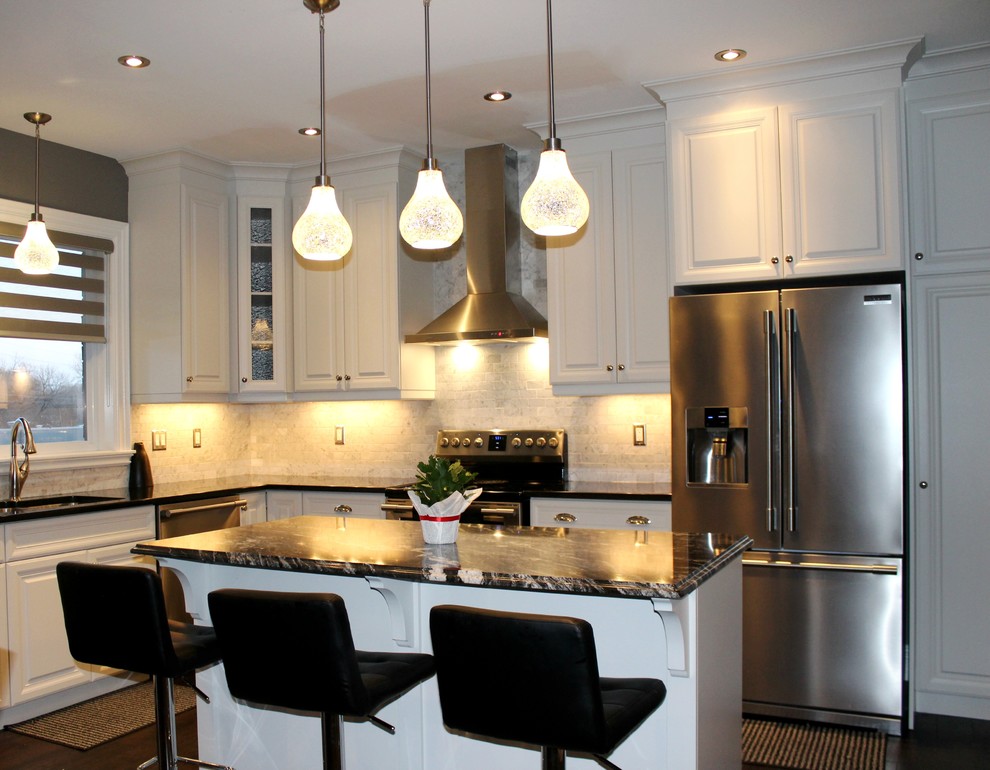 Mid-sized transitional l-shaped dark wood floor open concept kitchen photo in Toronto with an undermount sink, raised-panel cabinets, white cabinets, quartzite countertops, gray backsplash, subway tile backsplash, stainless steel appliances and an island