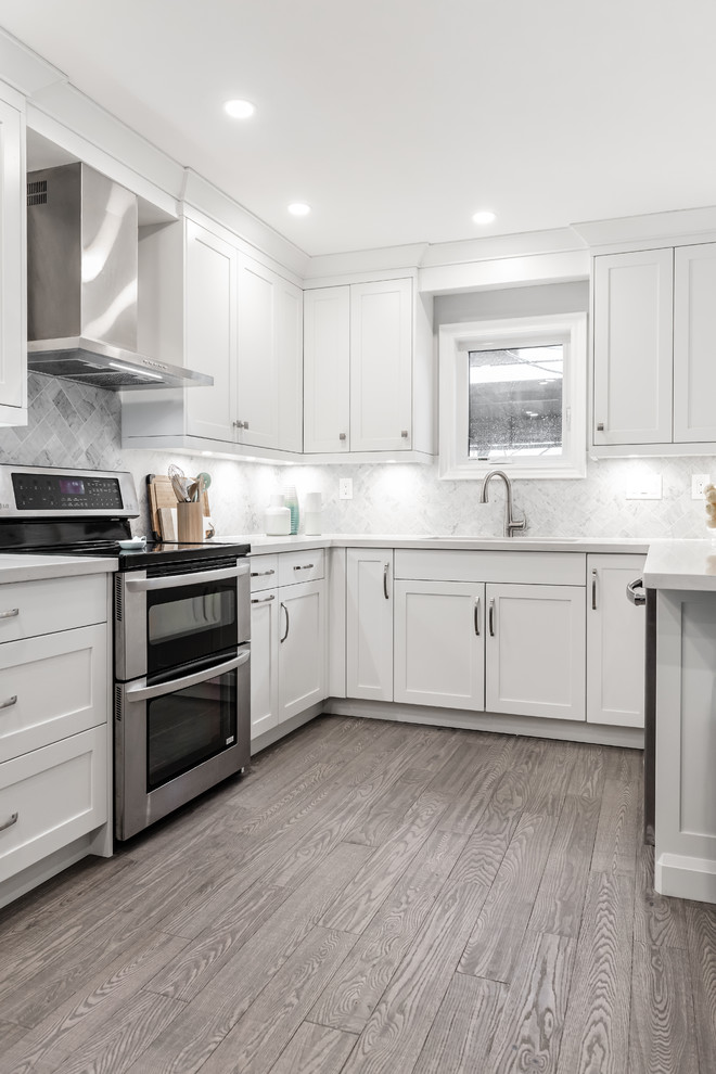 Example of a transitional kitchen design in Toronto