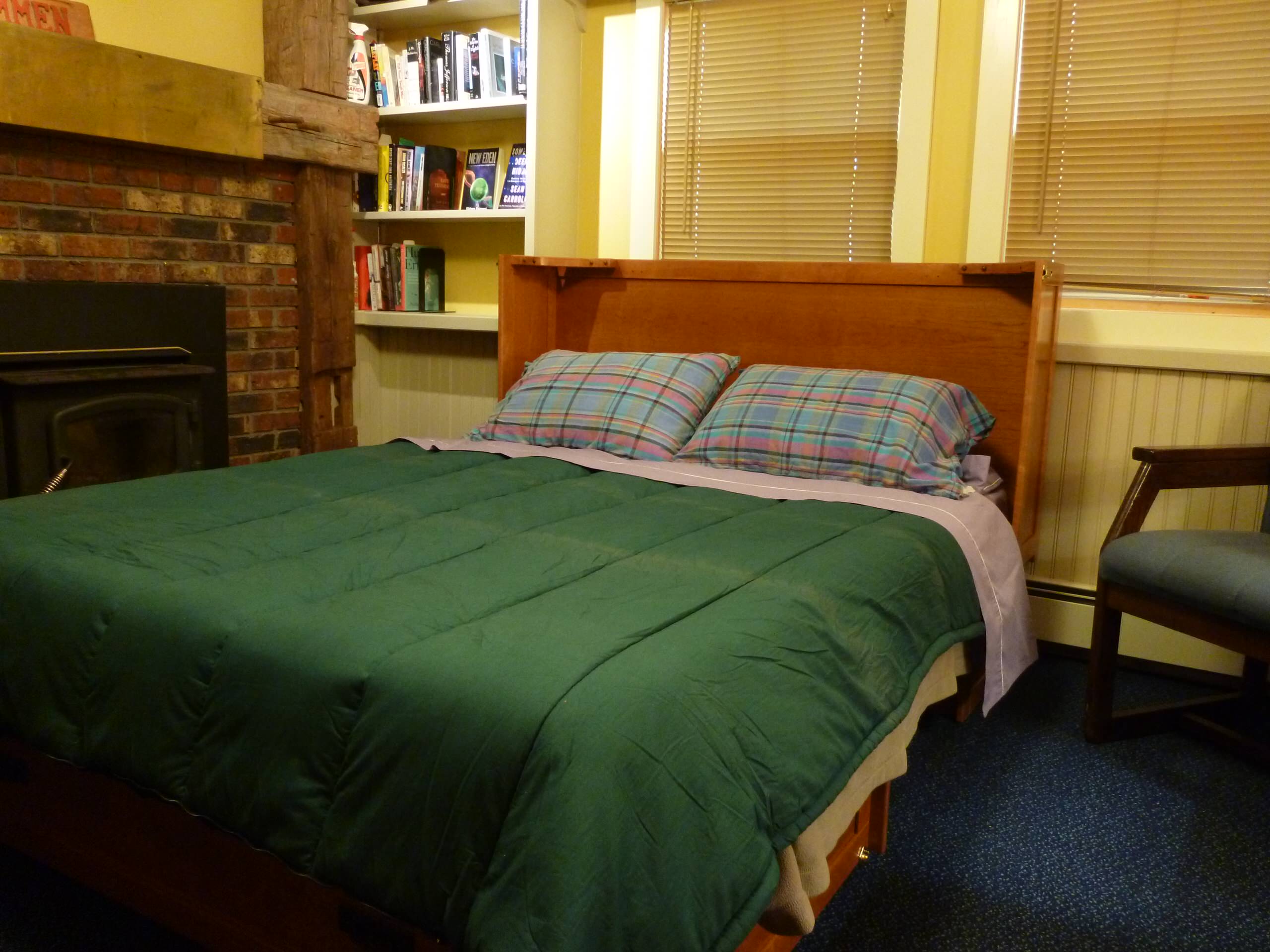 Cabinet bed- opened. Folds up into cabinet. In cherry hardwood.