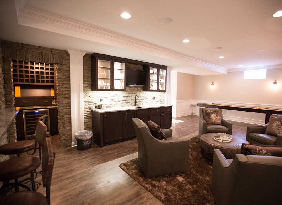 Large transitional open concept family room in Chicago with vinyl floors, a game room, beige walls, no fireplace, a built-in media wall and brown floor.
