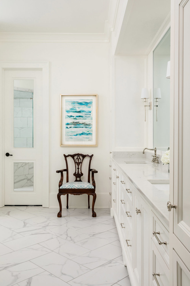 Photo of a mid-sized transitional master bathroom in Atlanta with raised-panel cabinets, white cabinets, white walls, marble floors, an undermount sink, marble benchtops, grey floor and grey benchtops.