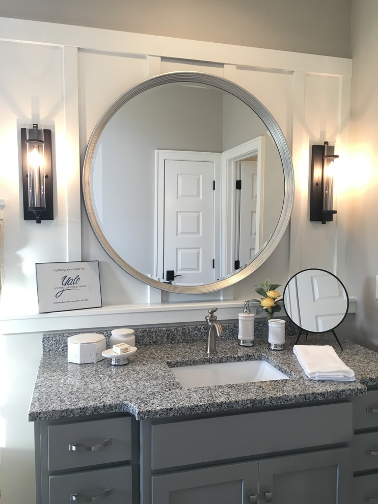 This is an example of a mid-sized transitional 3/4 bathroom in Other with shaker cabinets, grey cabinets, grey walls, an undermount sink, granite benchtops, grey floor and grey benchtops.