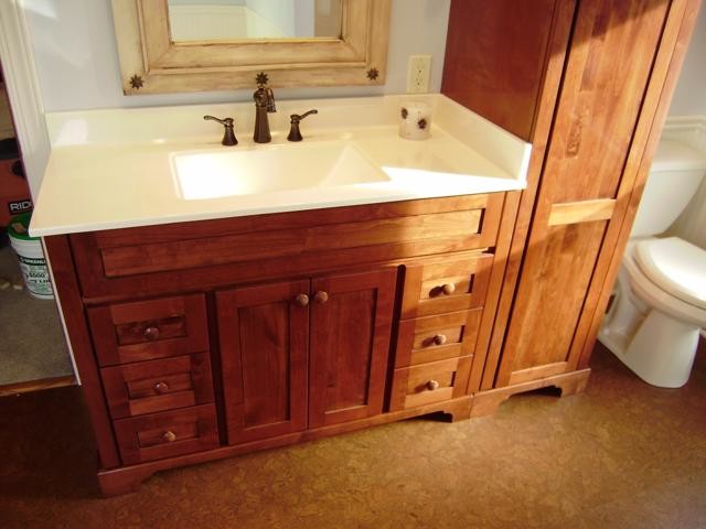 Design ideas for a small 3/4 bathroom in Cleveland with white cabinets, an alcove tub, a corner shower, a one-piece toilet, white tile, beige walls and medium hardwood floors.