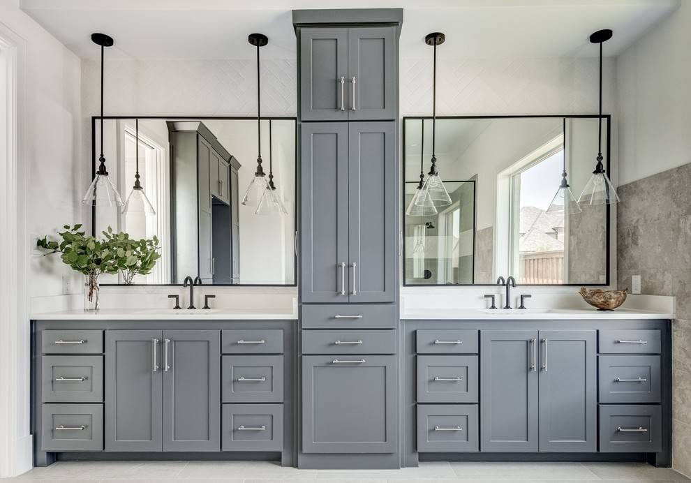 Inspiration for a farmhouse gray tile gray floor bathroom remodel in Dallas with shaker cabinets, gray cabinets, white walls, an undermount sink and white countertops