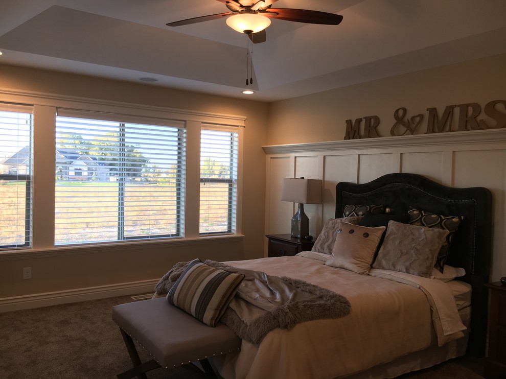 Bedroom - mid-sized transitional master carpeted bedroom idea with beige walls