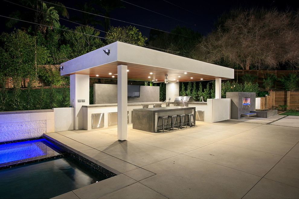 Inspiration for a large contemporary l-shaped eat-in kitchen in San Diego with a drop-in sink, stainless steel cabinets, concrete benchtops, stainless steel appliances, concrete floors, with island and grey floor.