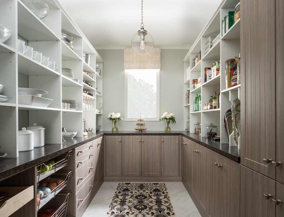 Example of a large minimalist u-shaped porcelain tile kitchen pantry design with shaker cabinets, brown cabinets, granite countertops and blue countertops