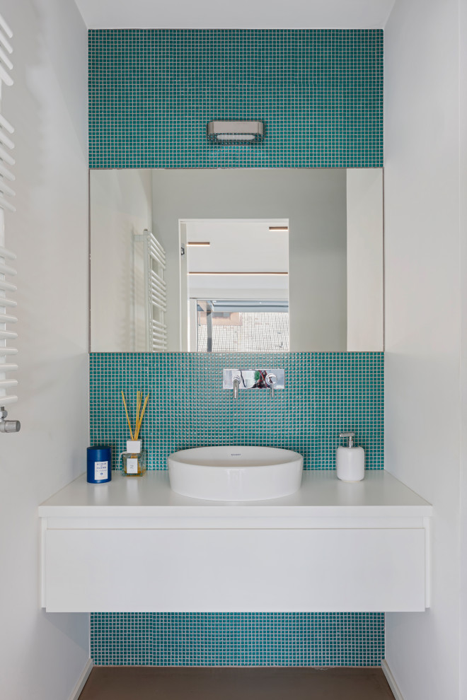 Small contemporary bathroom in Milan with flat-panel cabinets, white cabinets, green tiles, glass tiles, green walls, concrete flooring, a vessel sink, wooden worktops, grey floors, white worktops, a wall niche, a single sink, a built in vanity unit and a drop ceiling.