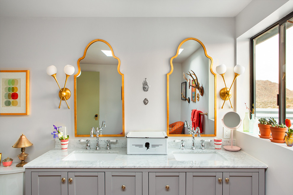 Large eclectic master bathroom in Other with recessed-panel cabinets, grey cabinets, a claw-foot tub, an open shower, a two-piece toilet, white tile, marble, grey walls, light hardwood floors, an undermount sink, marble benchtops, an open shower, white benchtops, a shower seat, a double vanity and a built-in vanity.
