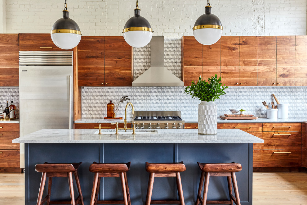 Transitional l-shaped light wood floor and beige floor kitchen photo in Philadelphia with an undermount sink, flat-panel cabinets, medium tone wood cabinets, gray backsplash, stainless steel appliances and an island