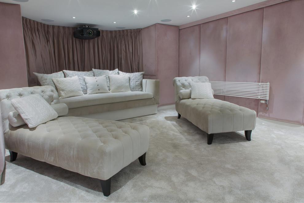 Photo of a small contemporary enclosed home theatre in London with pink walls, carpet and a projector screen.