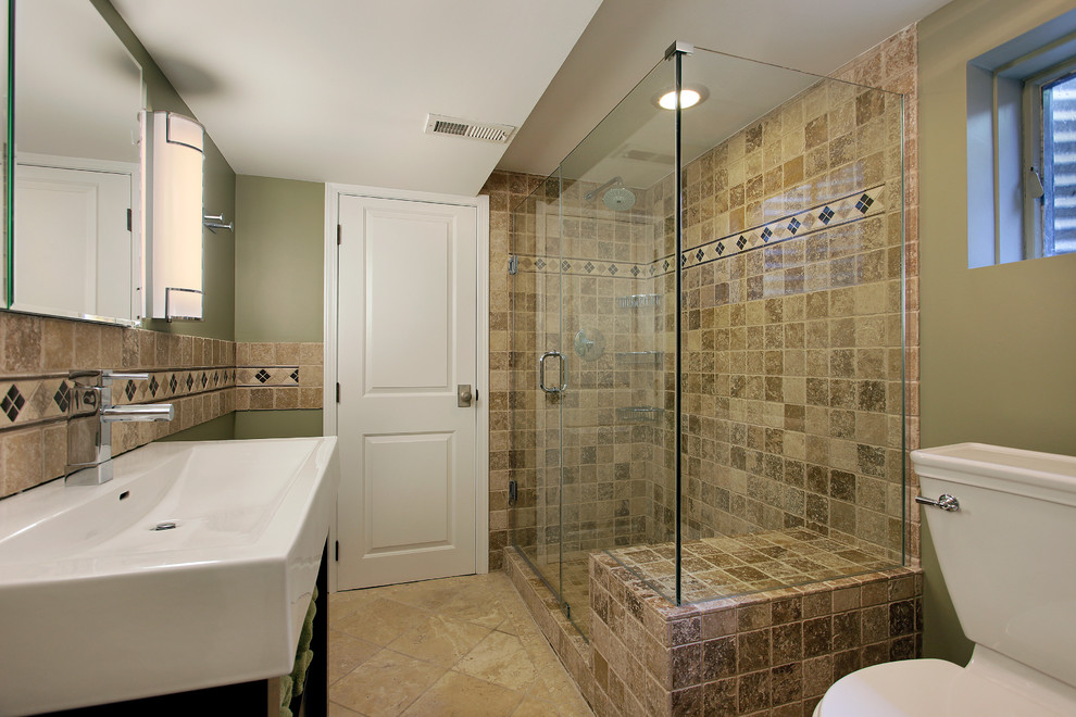 Inspiration for a large transitional master limestone floor and beige floor corner shower remodel in Toronto with open cabinets, a one-piece toilet, green walls, a trough sink and a hinged shower door