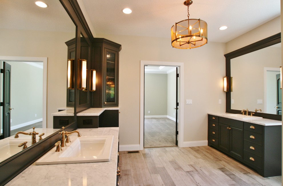 Inspiration for a transitional bathroom remodel with flat-panel cabinets and gray cabinets