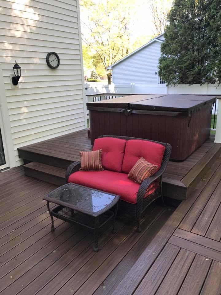 Example of a mid-sized backyard deck design with no cover