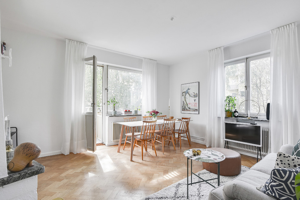Design ideas for a mid-sized scandinavian dining room in Stockholm with white walls and beige floor.