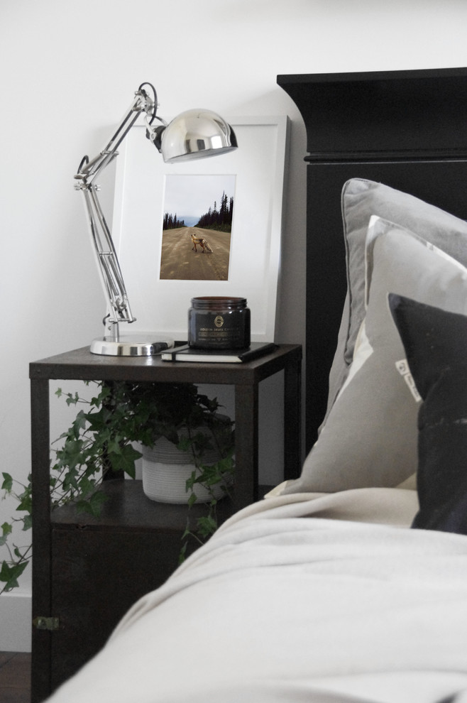 Design ideas for an eclectic bedroom in Melbourne with white walls and dark hardwood floors.