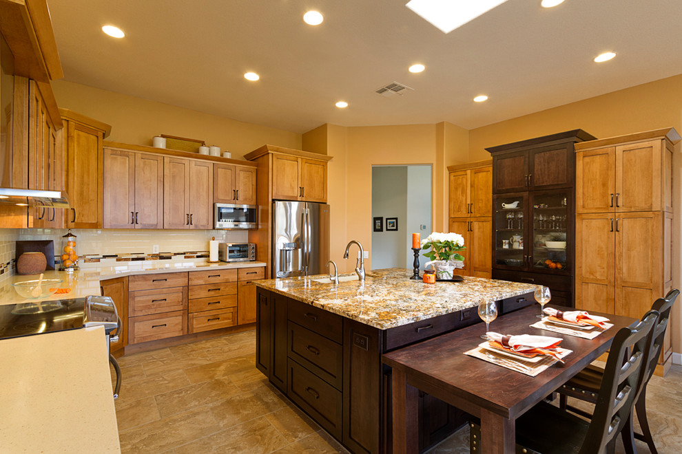 Large transitional kitchen photo in Phoenix with flat-panel cabinets, stainless steel appliances and an island