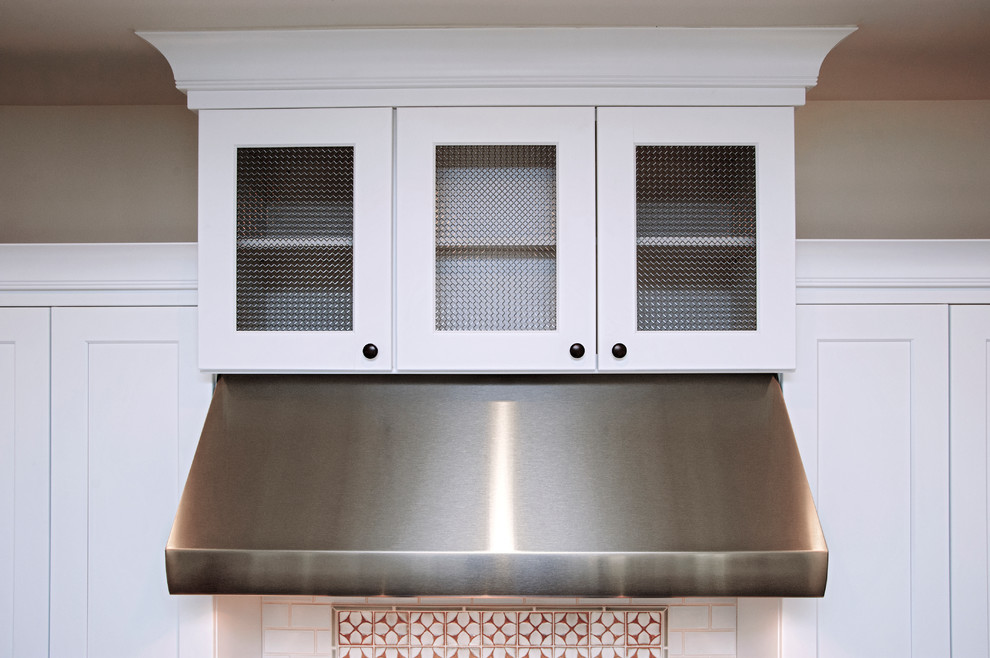 Inspiration for a transitional kitchen remodel in Denver with white cabinets