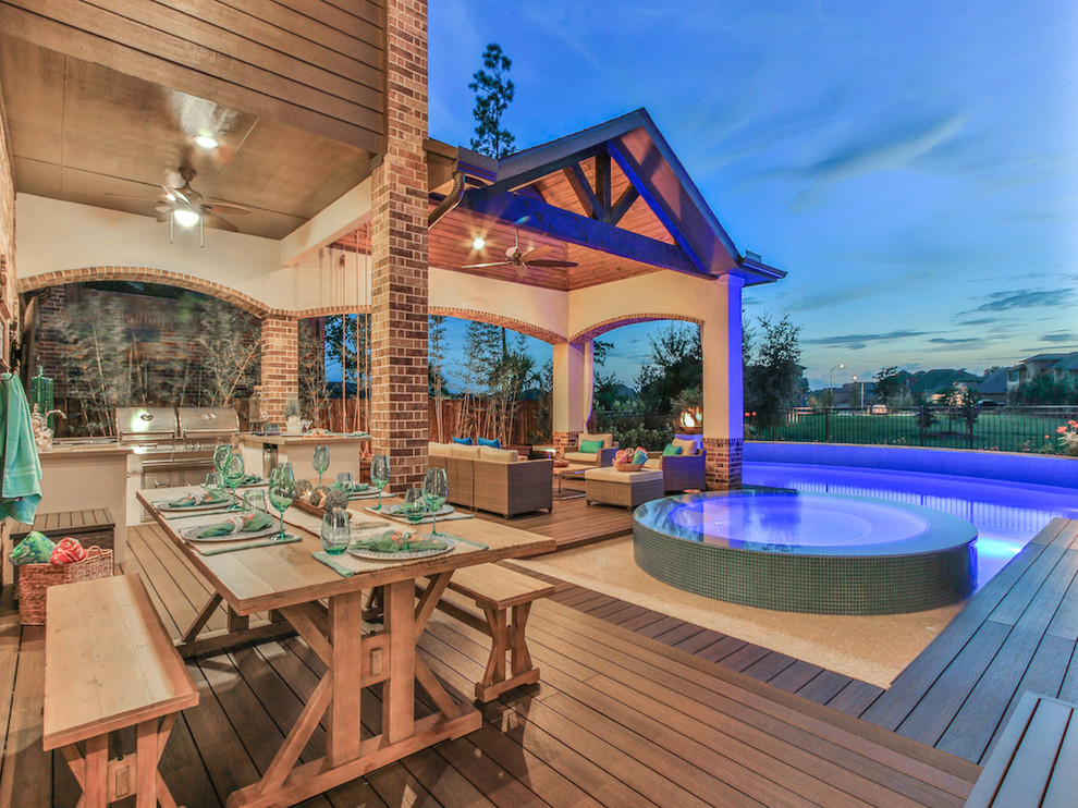 Inspiration for a large transitional backyard concrete and rectangular natural hot tub remodel in Houston