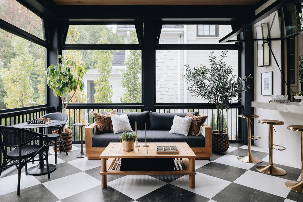 Transitional screened-in porch idea in Chicago with a roof extension