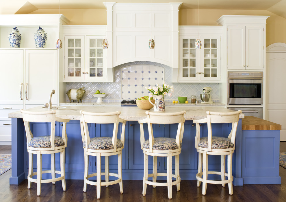Photo of a traditional kitchen in Denver with recessed-panel cabinets and blue cabinets.
