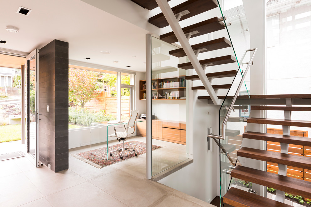 Trendy freestanding desk study room photo in Vancouver with white walls