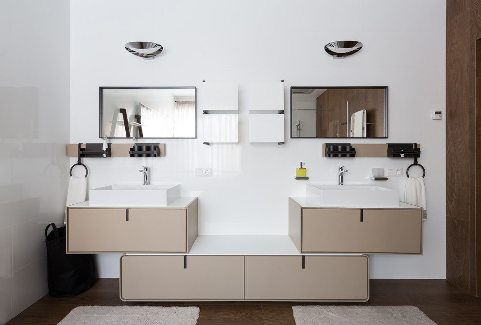 This is an example of a mid-sized contemporary bathroom in Saint Petersburg with flat-panel cabinets, ceramic tile, porcelain floors, solid surface benchtops, brown floor, beige cabinets, white tile and a vessel sink.