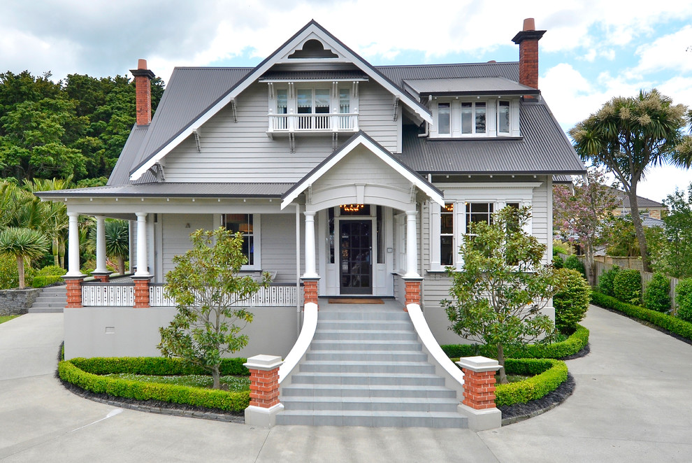 Design ideas for a large transitional two-storey grey exterior in Hamilton.