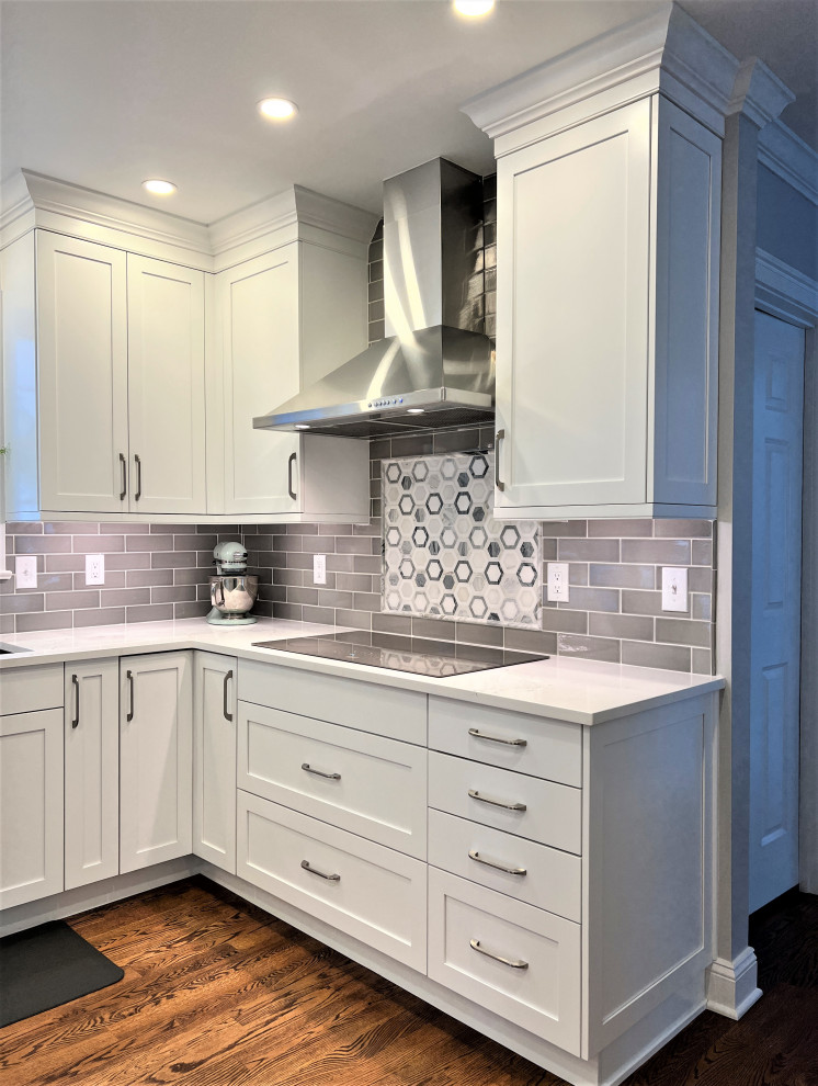 Inspiration for a transitional kitchen remodel with an undermount sink, shaker cabinets, white cabinets and stainless steel appliances