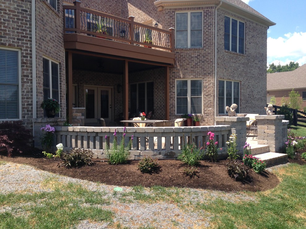Photo of a traditional patio in Other with natural stone pavers and no cover.